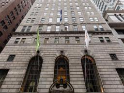 48 Wall Street historic building exterior showing limestone facade and architectural details
