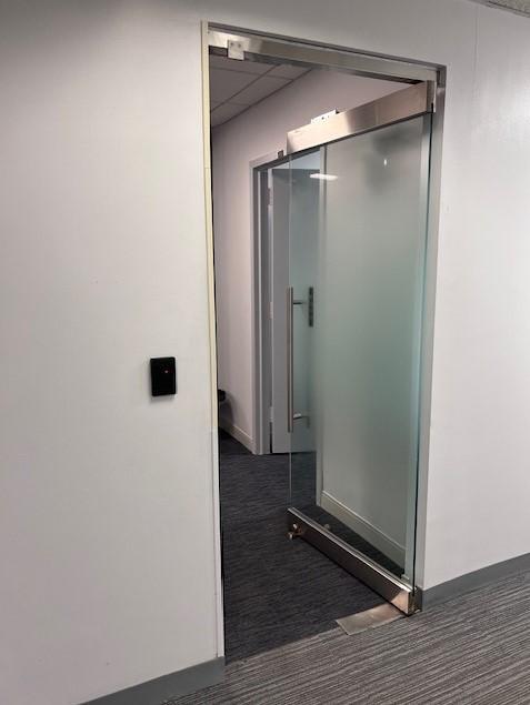 1350 Avenue of the Americas New York NY Locking glass entrance with key card access