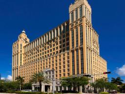Alhambra Towers building exterior showing three majestic towers with Mediterranean Revival architecture