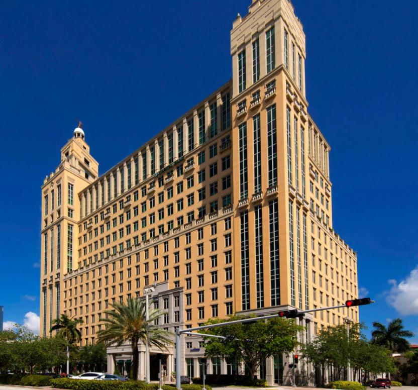 Alhambra Towers building exterior showing three majestic towers with Mediterranean Revival architecture