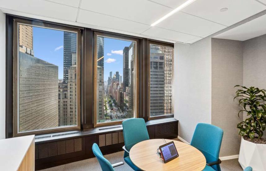Bright three window office with Park Avenue skyline view