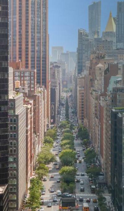 Elevated Park Avenue view with tree-lined median and surrounding office towers