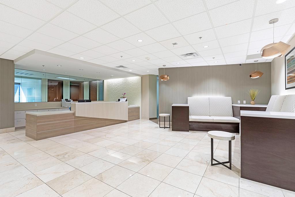 Large room with couches  and reception desk