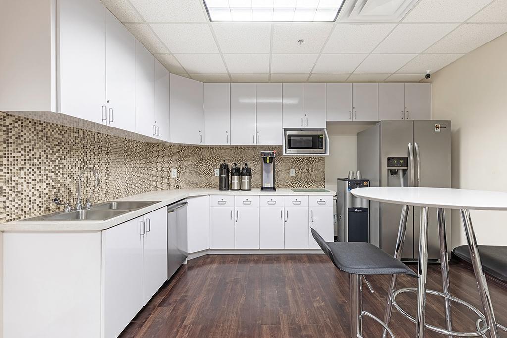 Modern cabinets and appliances in full kitchen