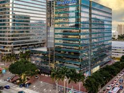 Modern glass office building with SunTrust signage in downtown Miami