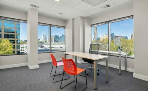 Room with many windows and desk